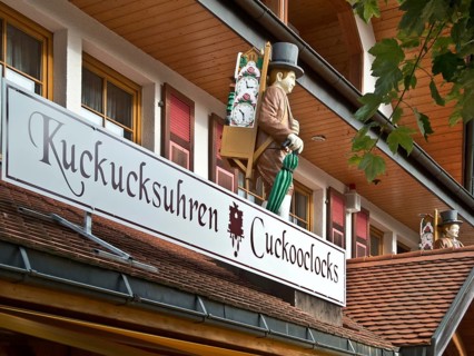 Clock carrier figure on a cuckoo clock shop in Titisee