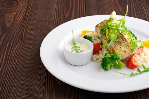 Closeup view of fried zander with rice