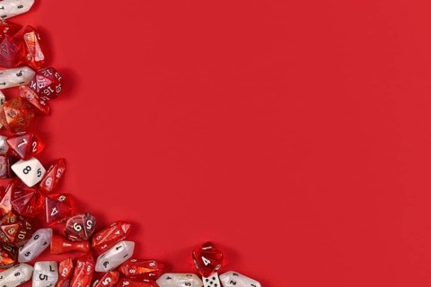 Roleplaying background with RPG dice at side of red background with blank copy space