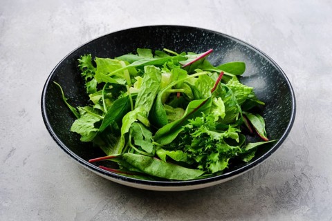 Plate with assortment of fresh salad leaves