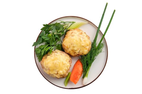 Cutlet covered with melted cheese served with fresh carrot