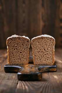 Loaf of artisan rye bread cut on half