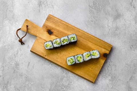 Top view of small rolls with cucumber