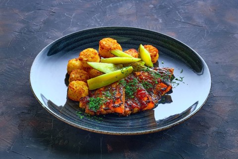 Grilled ribs with pickled cucumber and fried potato balls