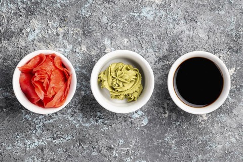 Flat lay ginger wasabi soy sauce bowls