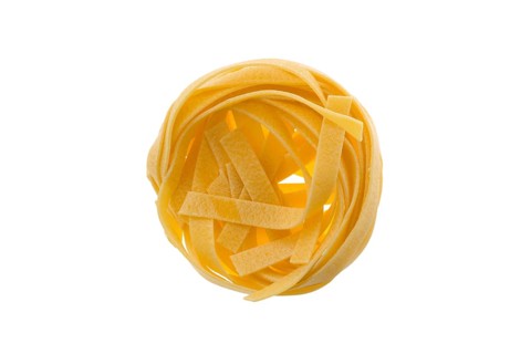 Top view of nest noodles isolated on white background. Italian tagliatelle with egg
