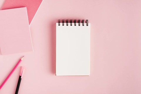 Notepad office supplies colored surface