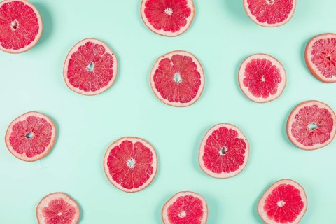 Pattern grapefruit citrus slices pastel backdrop. Resolution and high quality beautiful photo