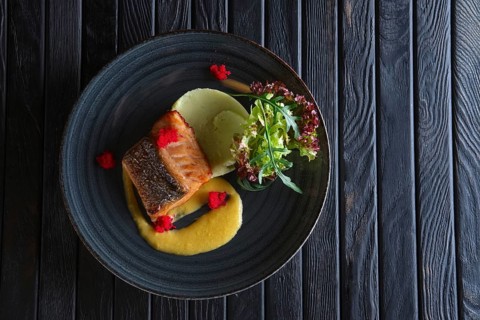 Fried salmon with mashed potato mixed with wasabi and decorated with flying fish roe