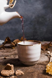 Front view tea being poured cup