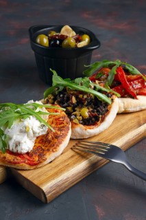 Delicious tapas set. Small sandwiches with goat cheese