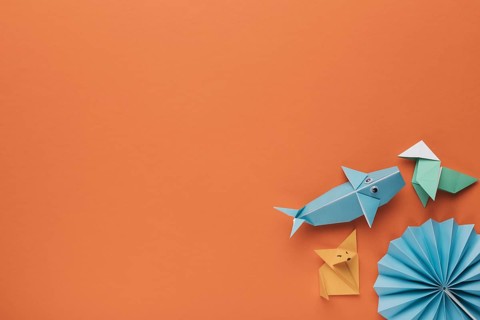Creative decorative origami art corner orange backdrop