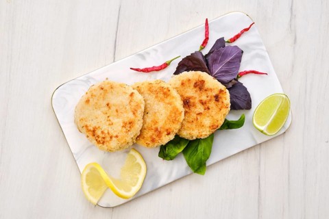 Top view of potato pancakes stuffed with chopped trout