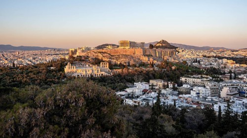 View from Philopappos Hill over the city at sunset