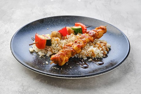Shashlik with chicken and grilled champignon with bell pepper and zucchini served with boiled rice