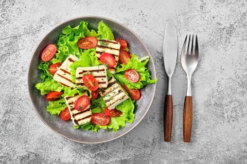 Top view of salad with grilled cheese