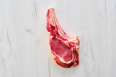 Overhead view of beef ribeye steak bone-in