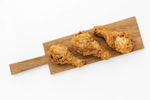 Top view fried chicken drumsticks cutting board. Resolution and high quality beautiful photo