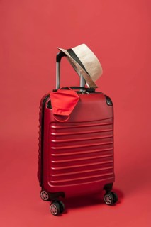 Red luggage with hat mask. Resolution and high quality beautiful photo