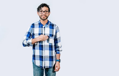 People gesturing SORRY in sign language isolated. Deaf and dumb person gesturing I'M SORRY in sign language. Gesticulation of SORRY in sign language. Nonverbal communication concept