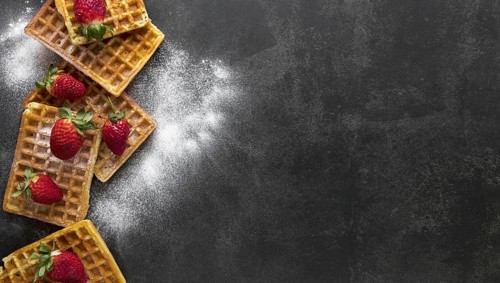 Top view waffles with powdered sugar strawberries. Resolution and high quality beautiful photo