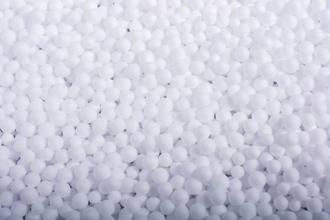White little polystyrene foam balls as background