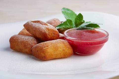 Curd bars with strawberry jam decorated with mint leaf