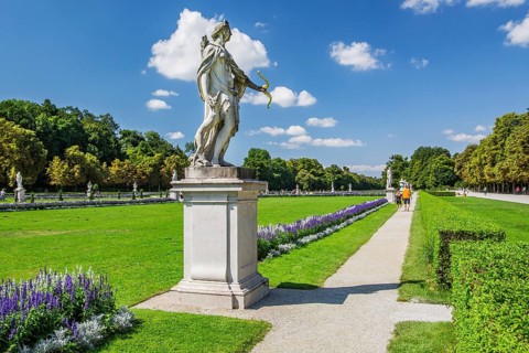 Baroque garden parterre with sculptures in the palace park of Nymphenburg Palace