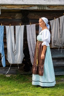Traditionla dressed women doing hand washing
