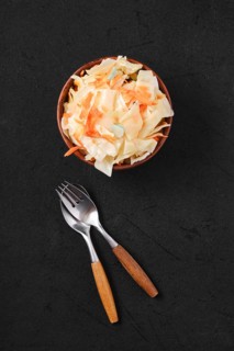 Overhead view of clay bowl with homemade pickled cabbage