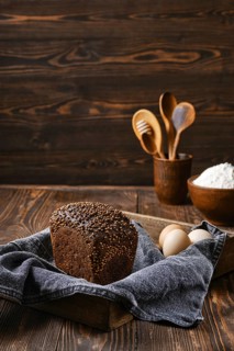 Fresh rye brown bread on wooden cutting board