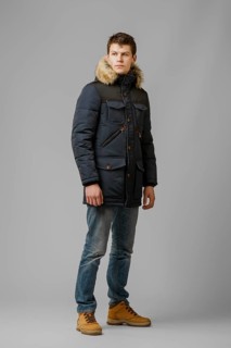 Full length portrait of handsome man in warm winter coat posing in studio