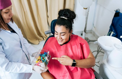 Patient with dentist choosing dental braces
