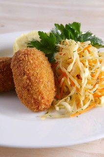 Chicken Kiev cutlet with pickled cabbage and mashed potato