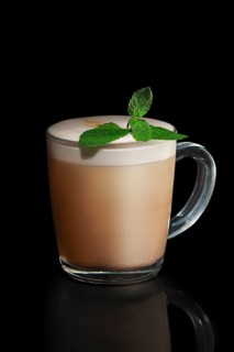 Transparent cup of mint Cappuccino isolated on black
