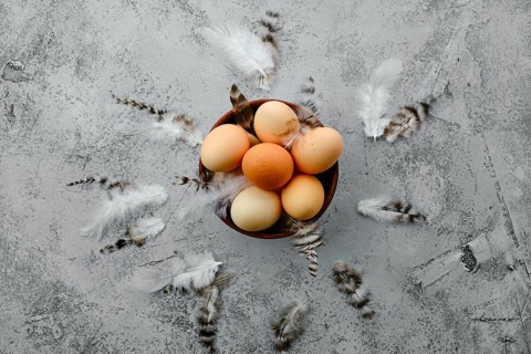 Fresh country eggs in clay bowl