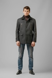Full length portrait of handsome man in warm woolen coat posing in studio