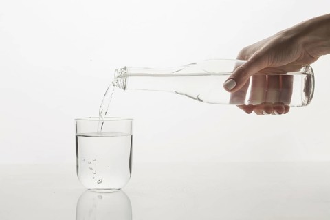 Person pouring water glass front view. Resolution and high quality beautiful photo