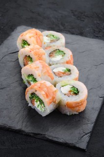 Rolls with shrimp and cream cheese on slate plate