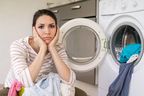 Upset woman doing laundry portrait. Resolution and high quality beautiful photo