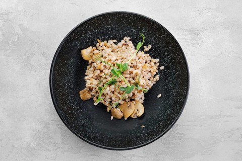 Boilet pearl barley with fried mushrooms