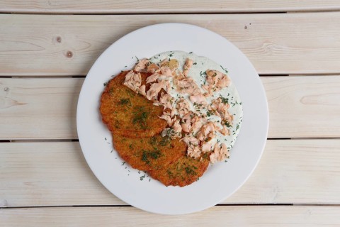 Potato pancakes with chopped salmon. Top view