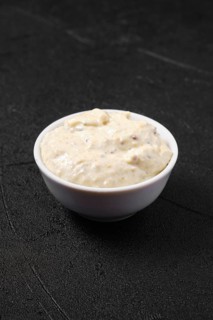 Small bowl with caesar sauce for salad