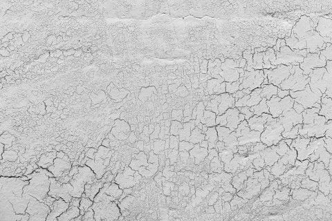 Grey lime plaster with cracks background