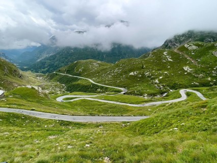 Hairpin bends with approaching weather front at Colle del Nivolet