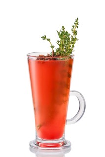 Hot watermelon winter drink with thyme and anise isolated on white