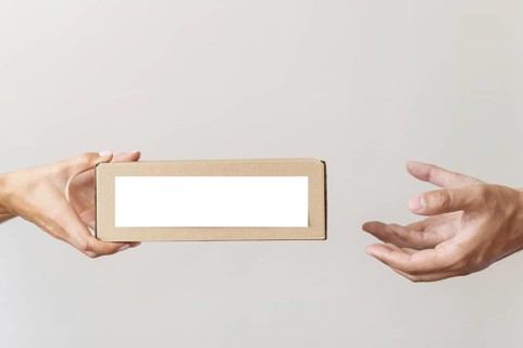 Hand giving donation box needy person