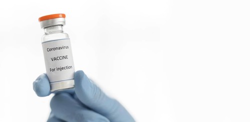 Doctor holding coronavirus vaccine recipient with copy space