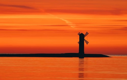 Beautiful sunset with a windmill in the background