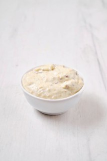 Small bowl with caesar sauce for salad